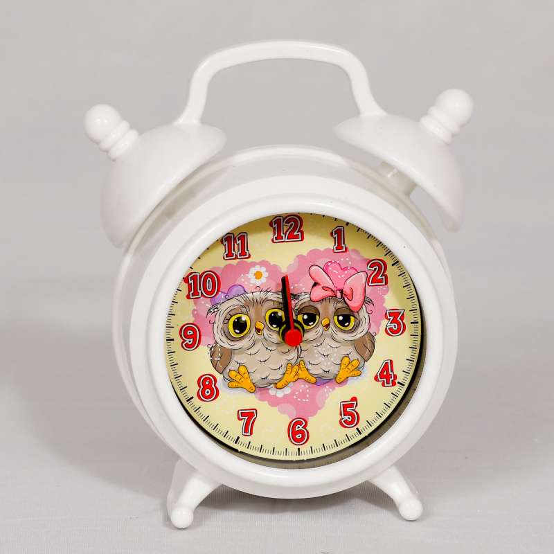 white alarm clock with colorful picture of birds