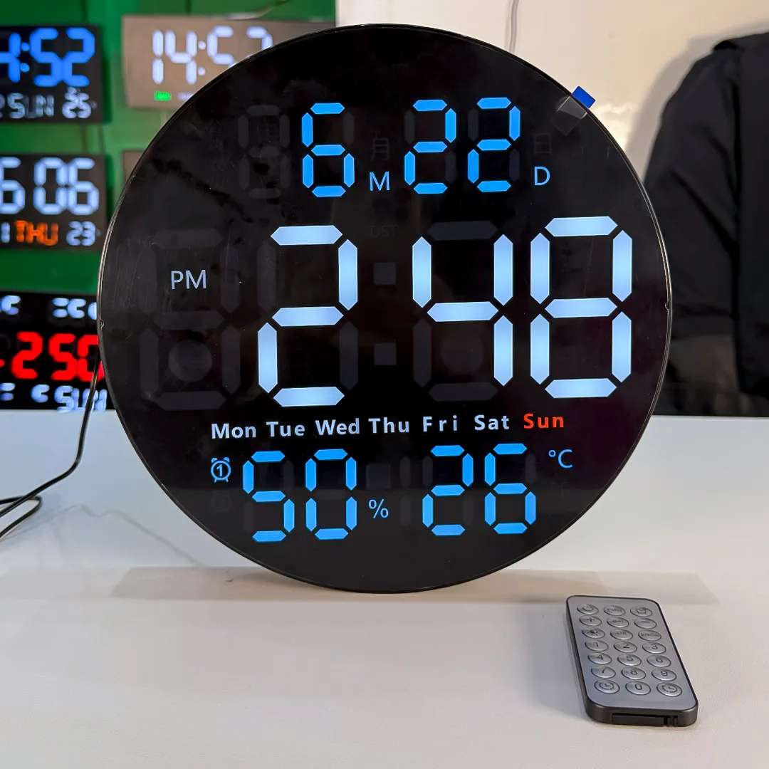 Full view of Round LED Wall Clock showing time, day, humidity and temperature with remote resting below